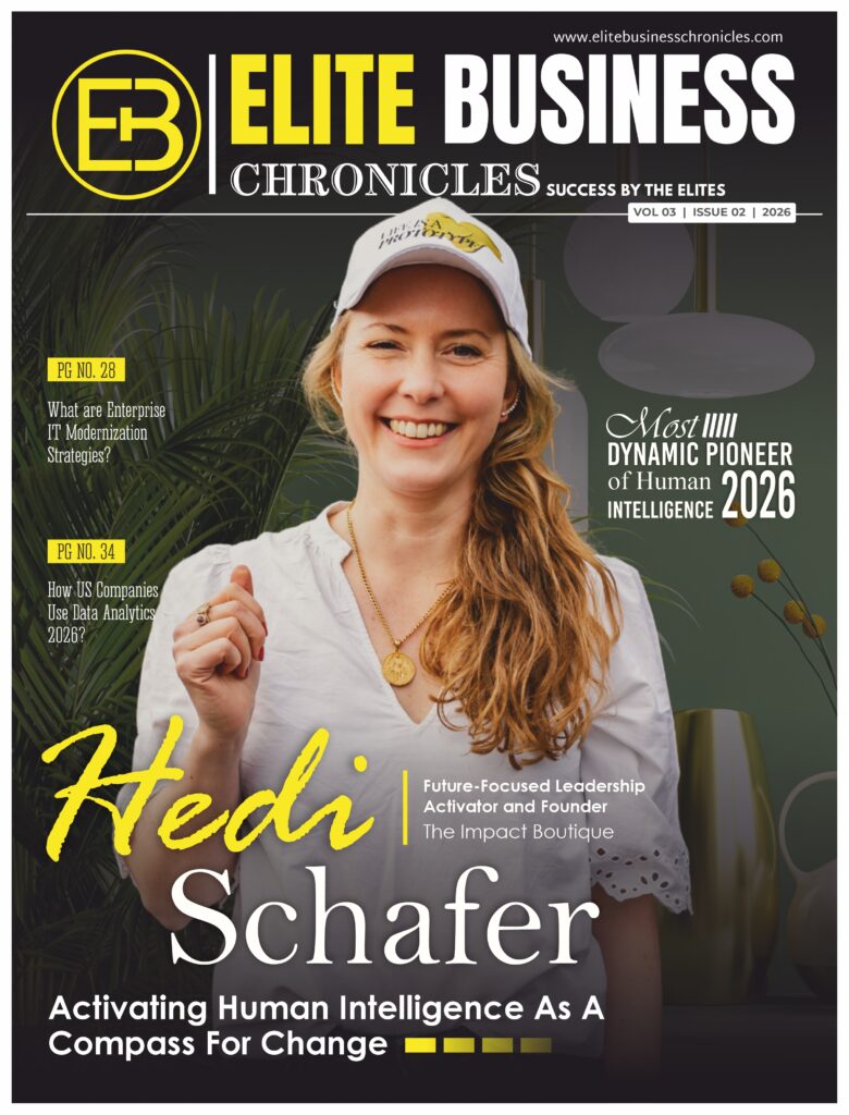 A professional magazine-style cover from Elite Business Chronicles features Hedi Schafer, Founder of The Impact Boutique and a Future-Focused Leadership Activator. She appears confidently at the center of the cover, dressed in a casual white outfit and cap, smiling with a warm and approachable presence that reflects her human-centric leadership philosophy. The masthead “Elite Business Chronicles” appears prominently at the top, accompanied by the tagline “Success by the Elites.” The issue highlights Hedi as the “Most Dynamic Pioneer of Human Intelligence 2026.”